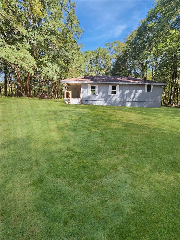 147 Cobb Road Covington, GA 30014 - Photo 11 of 21 a front view of a house with a yard