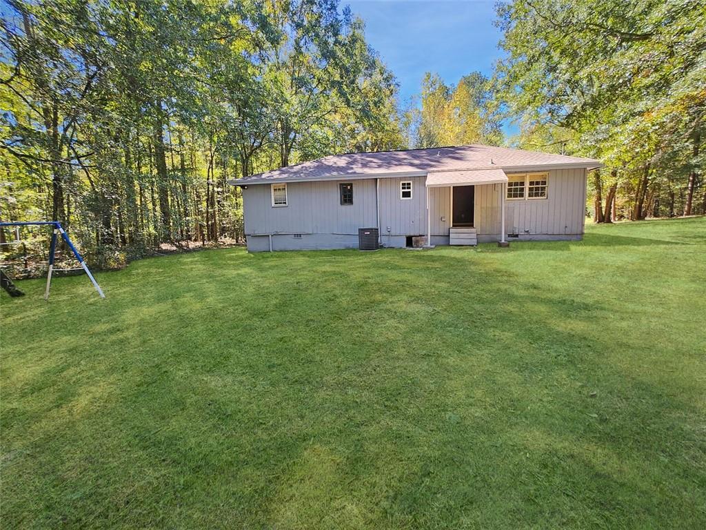 147 Cobb Road Covington, GA 30014 - Photo 21 of 21 a view of a house with a backyard
