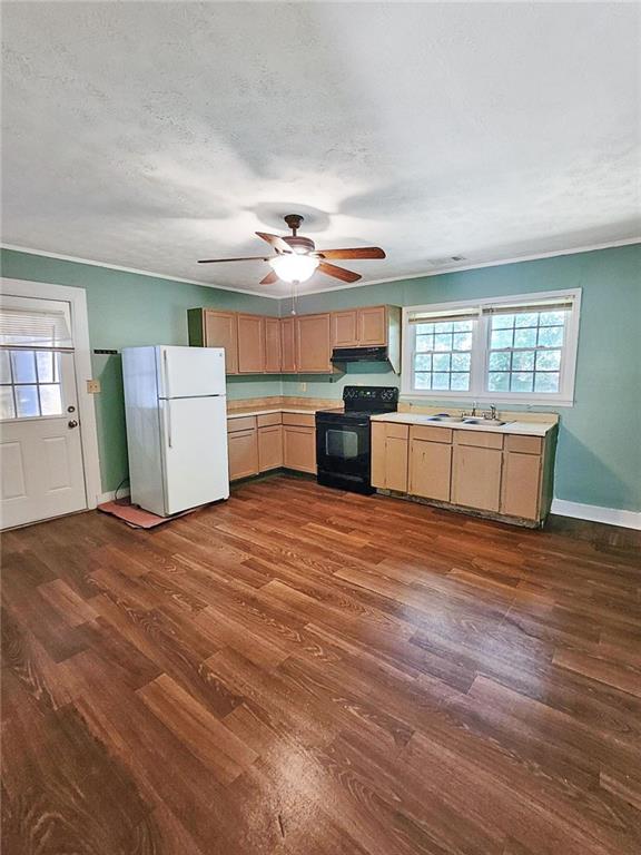 147 Cobb Road Covington, GA 30014 - Photo 5 of 21 a kitchen with stainless steel appliances granite countertop a stove a sink dishwasher and a refrigerator with wooden floor