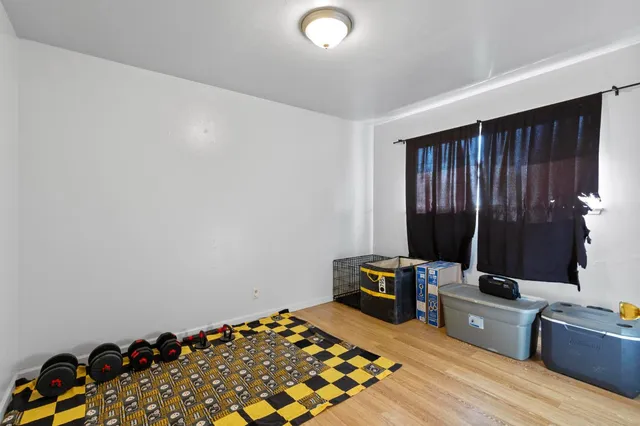 a bed room with a bed and a television