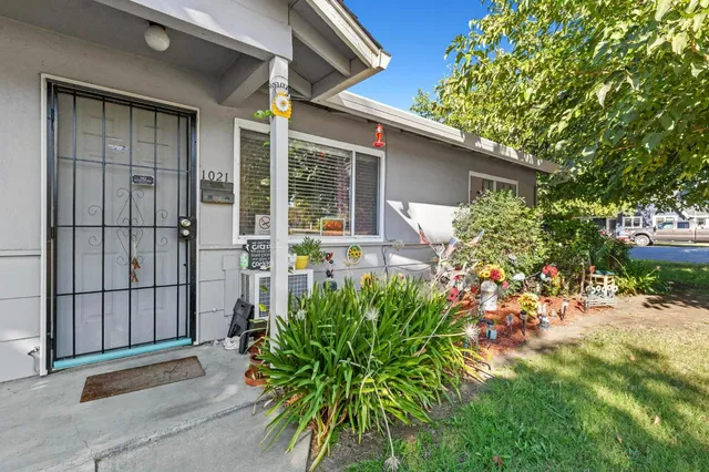 front view of a house with a garden