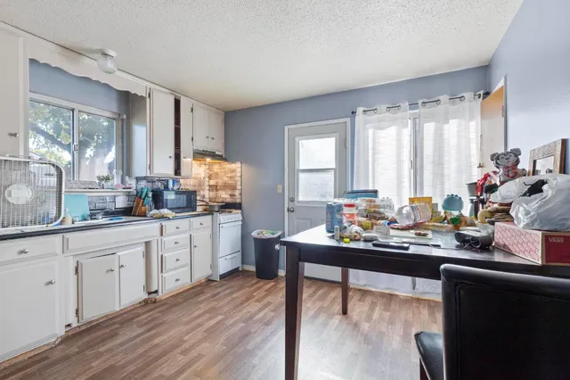 a room with wooden floor and window
