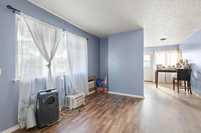 a view of a livingroom with furniture and a window