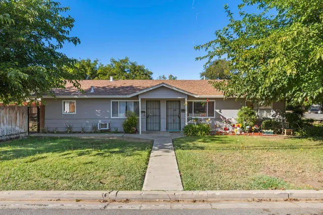 a front view of a house with a yard