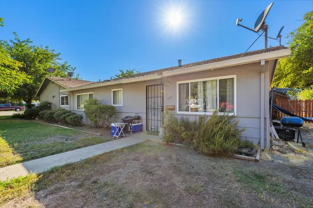 front view of a house with a patio