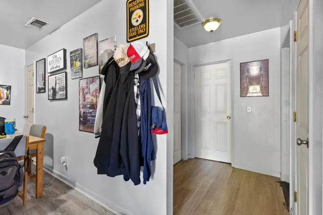 a very nice looking room with a white walls and a bed