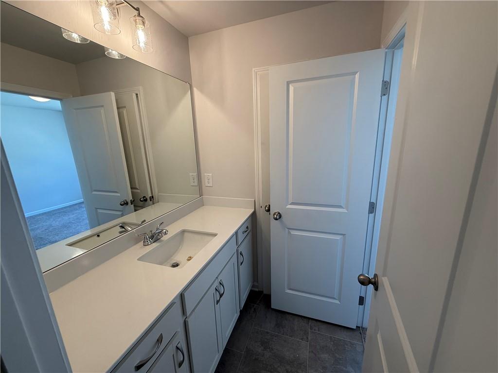 5139 Longview Run Decatur, GA 30035 - Photo 9 of 16 a bathroom with a sink a vanity and a mirror