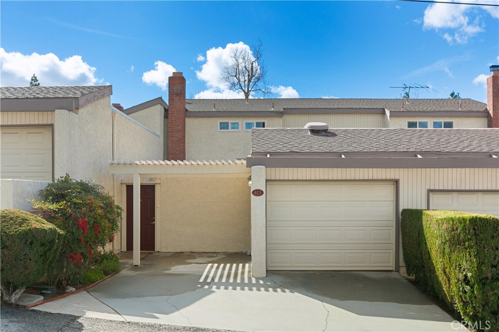 a front view of a house with a garage