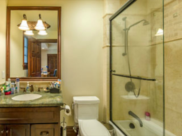 632 Fairway Circle Hillsborough, CA 94010 - Photo 13 of 18 a bathroom with a granite countertop sink toilet and shower
