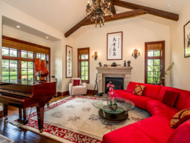 632 Fairway Circle Hillsborough, CA 94010 - Photo 2 of 18 a living room with furniture a fireplace and a chandelier
