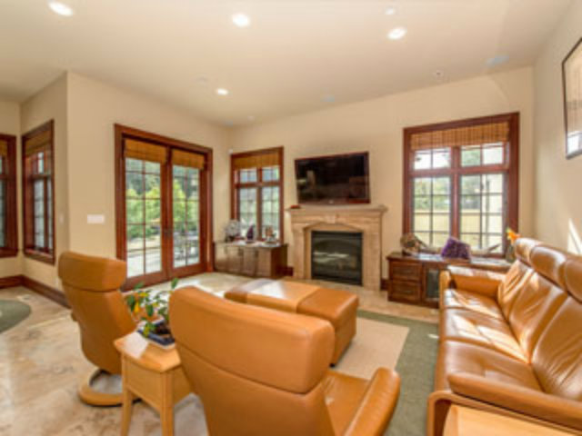 632 Fairway Circle Hillsborough, CA 94010 - Photo 6 of 18 a living room with furniture fireplace and a large window