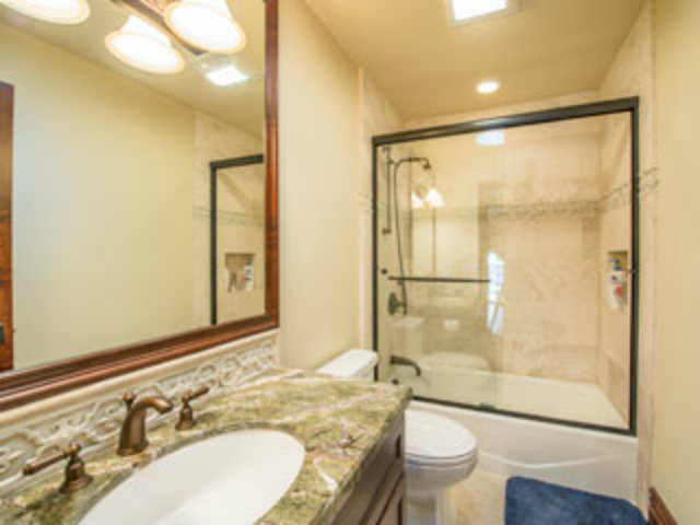 632 Fairway Circle Hillsborough, CA 94010 - Photo 9 of 18 a bathroom with a granite countertop sink toilet and shower