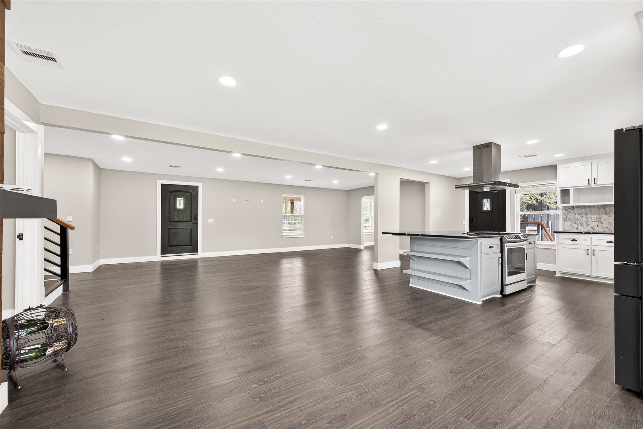 803 County Road 772 Damon, TX 77430 - Photo 22 of 50 a view of a living room a kitchen with wooden floor and furniture