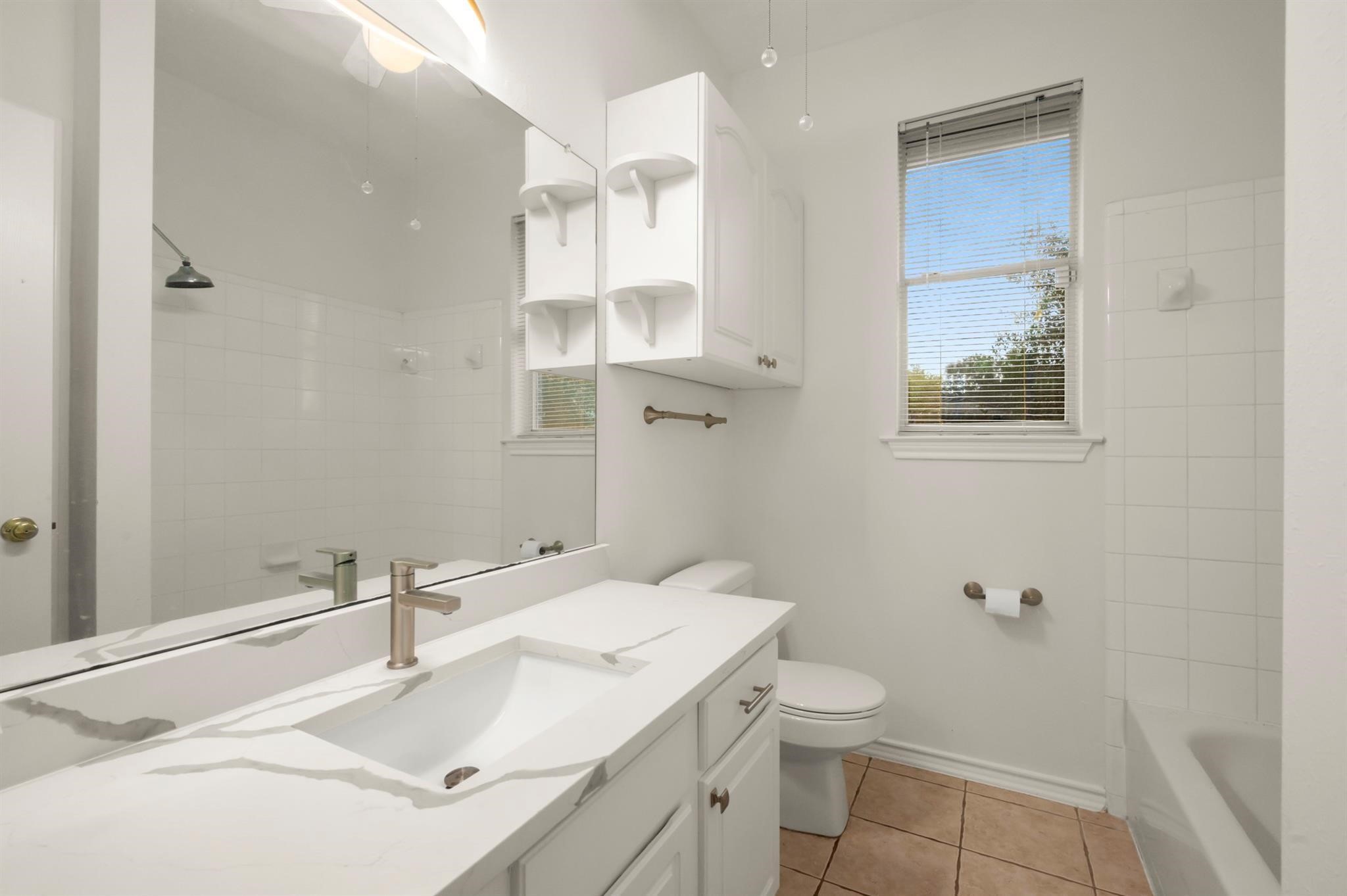 21014 Jessica Rose Lane Spring, TX 77379 - Photo 17 of 30 a bathroom with a sink toilet and shower