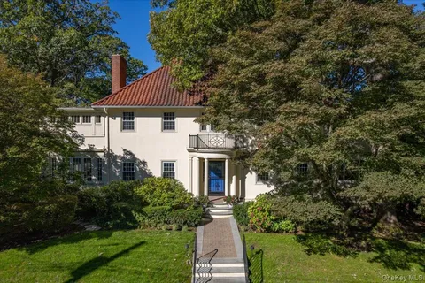 a living room with furniture fireplace and flat screen tv