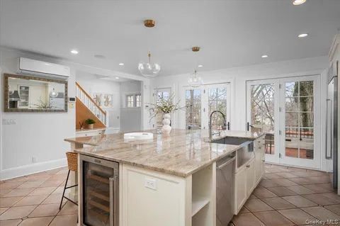 a kitchen with a stove a refrigerator and a sink