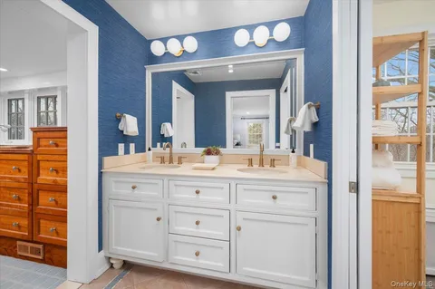 a bathroom with a sink a vanity and a mirror