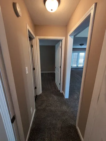 a bathroom with a sink a toilet a mirror and shower