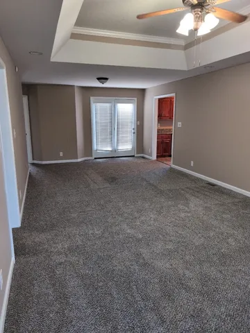 a view of an empty room with a window