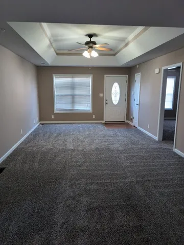 a view of a hallway with a window