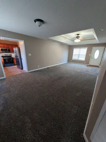 a view of an empty room with a window