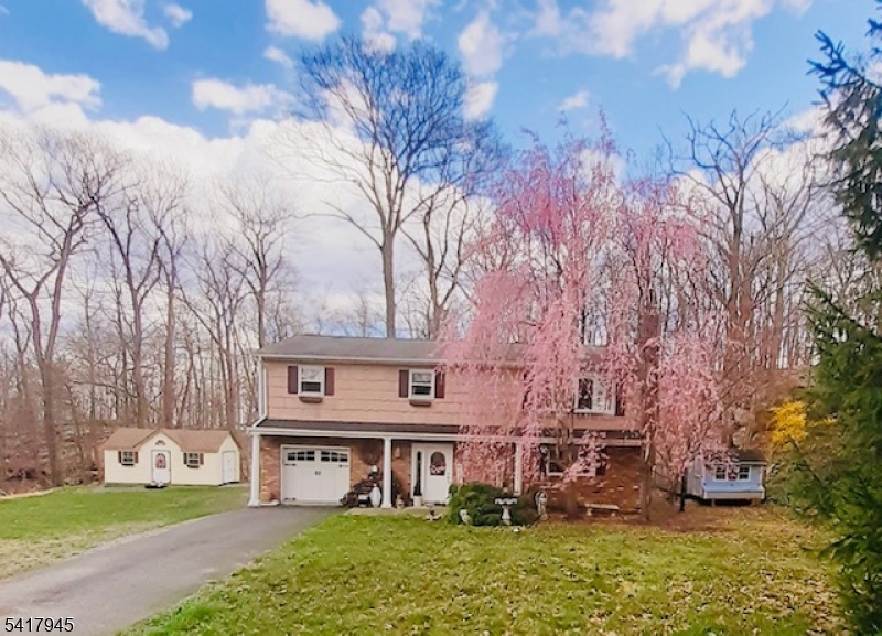 47 Indian Trail Hopatcong, NJ 07821 - Photo 1 of 17 a front view of a house with garden