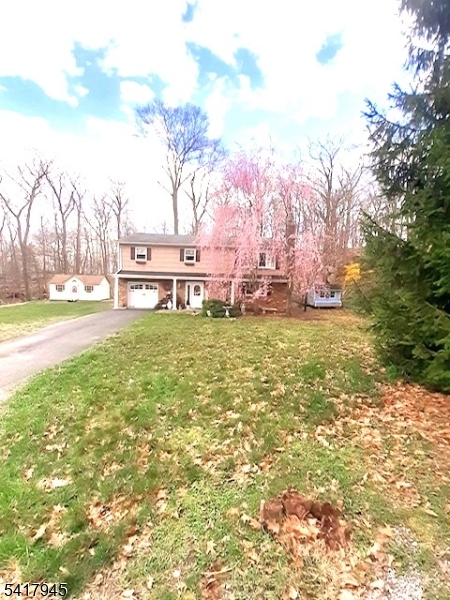 47 Indian Trail Hopatcong, NJ 07821 - Photo 11 of 17 a backyard of a house with table and chairs