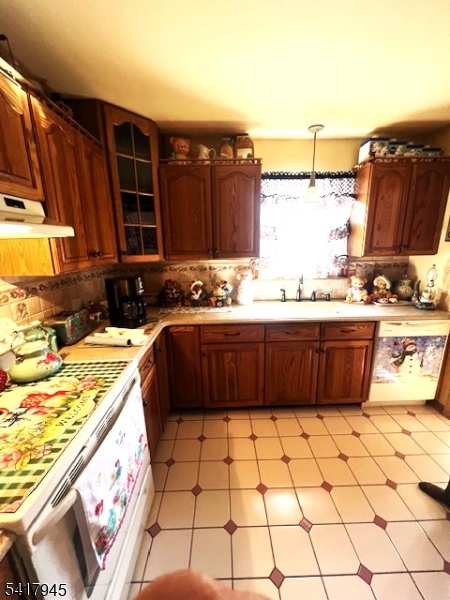 47 Indian Trail Hopatcong, NJ 07821 - Photo 2 of 17 a kitchen with a sink a stove and a cabinets