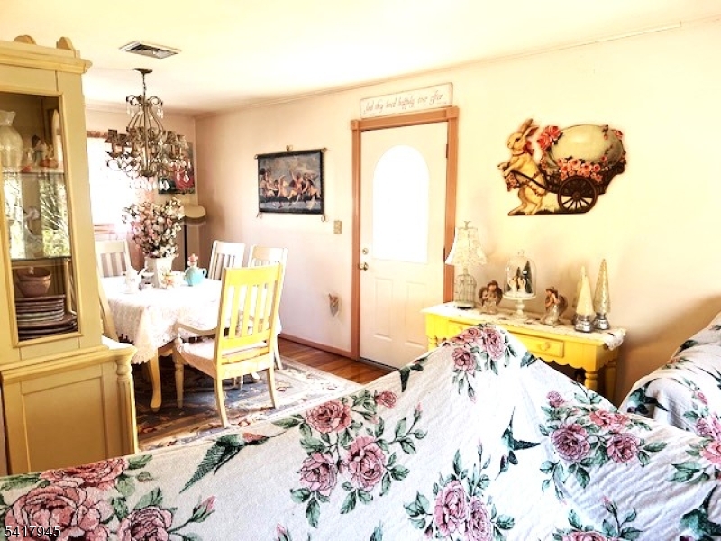 47 Indian Trail Hopatcong, NJ 07821 - Photo 7 of 17 a bed room with a bed and a chair