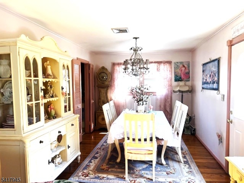 47 Indian Trail Hopatcong, NJ 07821 - Photo 9 of 17 a view of a dining room with furniture and chandelier