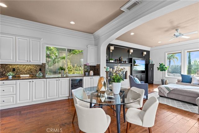 a living room with kitchen island furniture and a wooden floor
