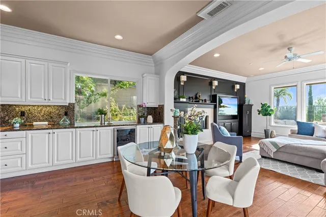 a living room with kitchen island furniture and a wooden floor