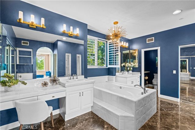 a view of living room with granite countertop furniture and a chandelier
