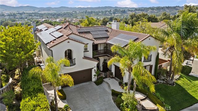 an aerial view of a house with a garden