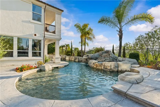 a view of a swimming pool with lounge chair