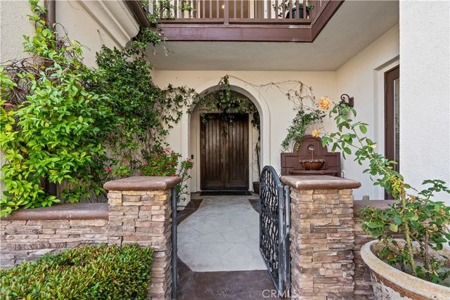 a view of entryway with flower pots