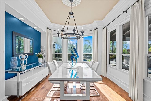 a very nice looking room with a large window and table