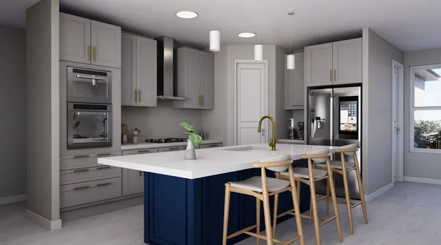 a kitchen that has a table and chairs in it