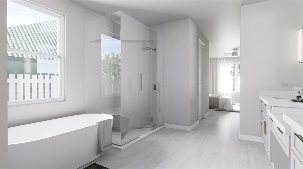 6499 Southwest 117th Street Ocala, FL 34476 - Photo 8 of 9 a bathroom with a sink a toilet and a tub