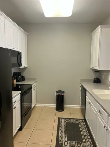 a kitchen with a stove and a refrigerator