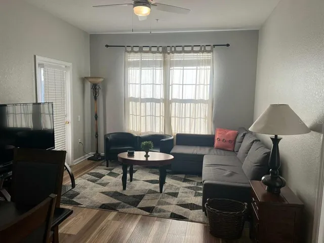 a living room with furniture and a window