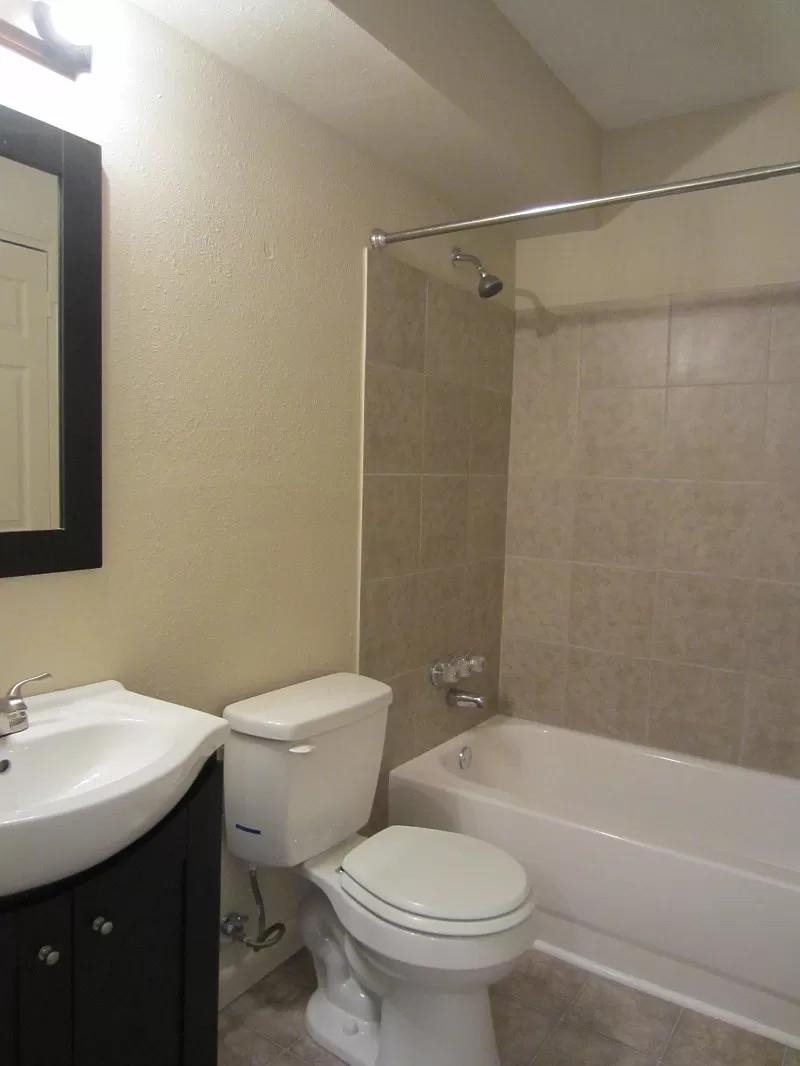 53 West Rollins Road Memphis, TN 38109 - Photo 4 of 16 a bathroom with a sink toilet and shower