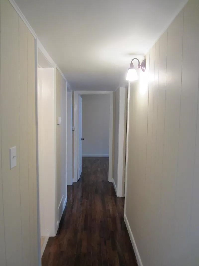 53 West Rollins Road Memphis, TN 38109 - Photo 5 of 16 a view of a hallway with wooden floor