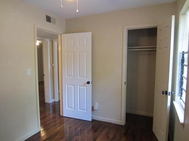 53 West Rollins Road Memphis, TN 38109 - Photo 7 of 16 an empty room with wooden floor & window