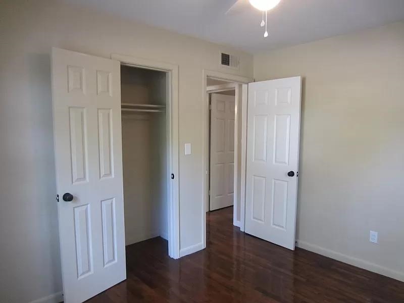 53 West Rollins Road Memphis, TN 38109 - Photo 8 of 16 an empty room with wooden floor & closet area