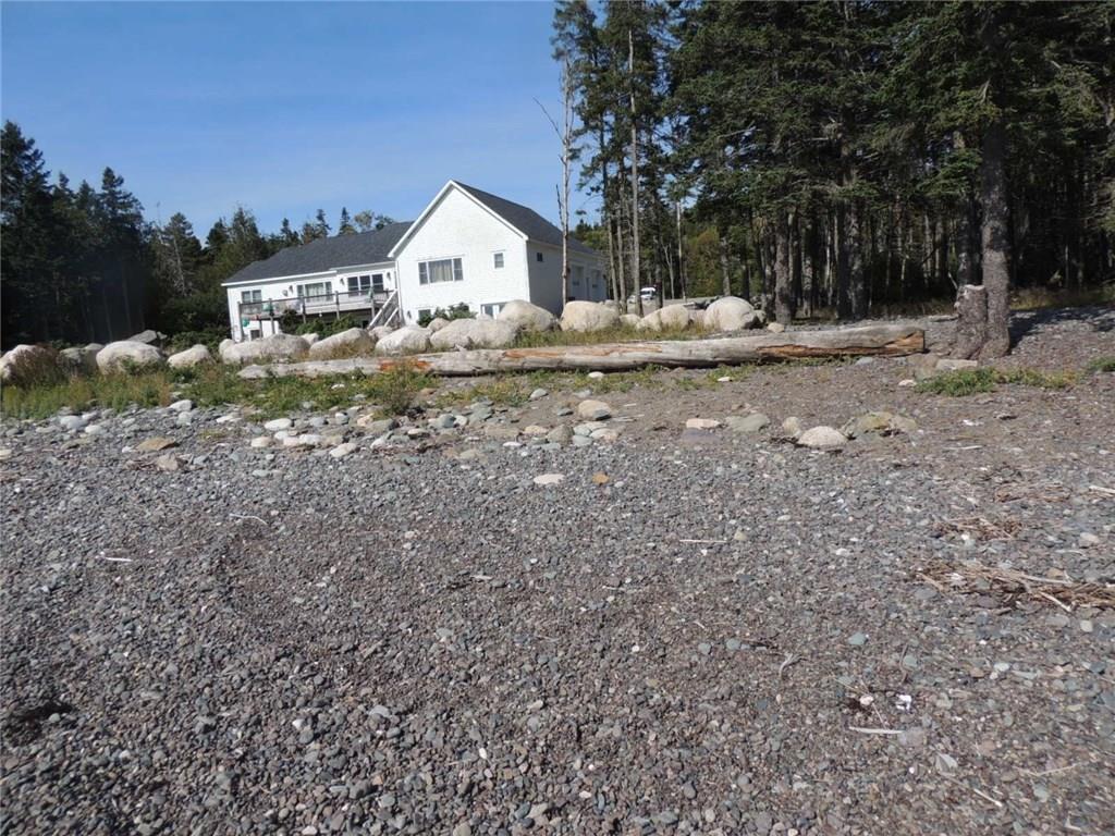 364 Pettegrow Point Road Machiasport, ME 04655 - Photo 3 of 34 Back of house from beach.