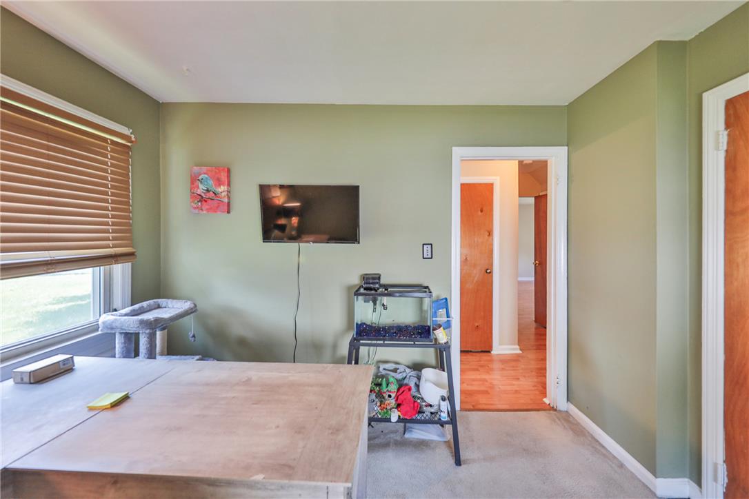 3050 Cornwall Road Bethlehem, PA 18017 - Photo 27 of 80 A versatile space features a bright window and comfortable carpet, offering potential for various uses.