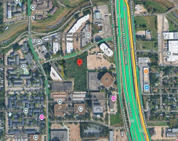 an aerial view of a fireplace with table and chairs