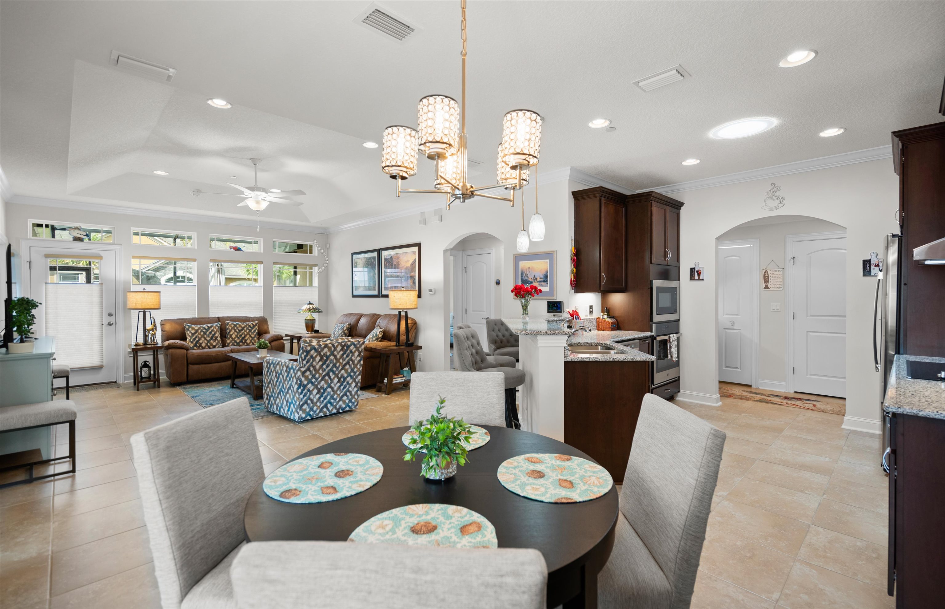 102 Timoga Trail St. Augustine, FL 32084 - Photo 15 of 44 a very nice looking dining room with furniture a kitchen and wooden floor