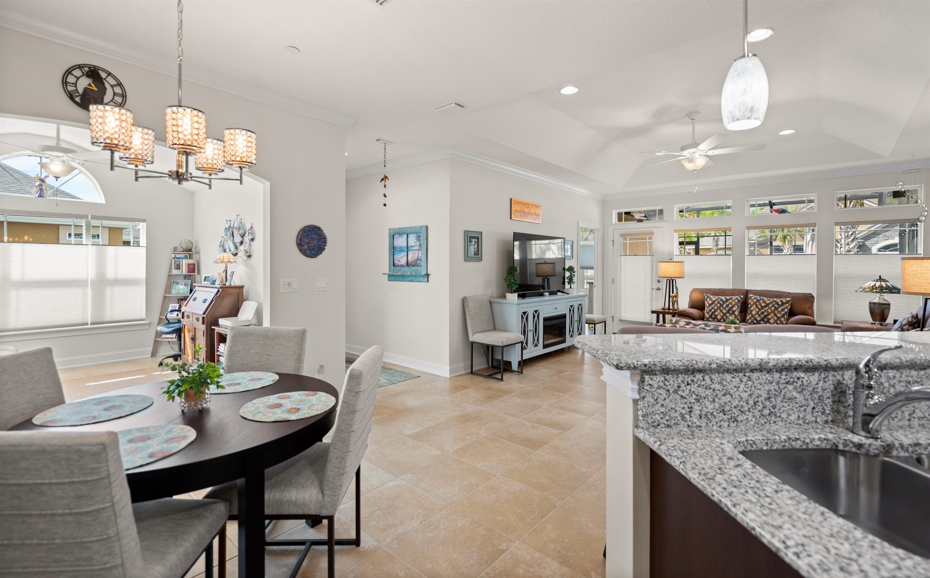 102 Timoga Trail St. Augustine, FL 32084 - Photo 16 of 44 a kitchen with granite countertop a table and chairs in it